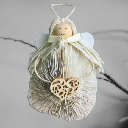 Adorable Handmade Shell Angel made of light seashell, wooden heart and bow.