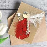 Beautiful Fancy Handmade Female Birthday Card Idea made of vibrant red and white feathers, with white wings and star.