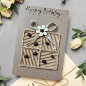 Beautiful Handmade Eco-Friendly Birthday Card with birthday box, wooden flower and happy birthday text.