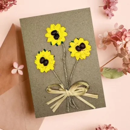 Beautiful Handmade Mother's Day Floral Card made of yellow paper, coffee beans and woven on brown paper.