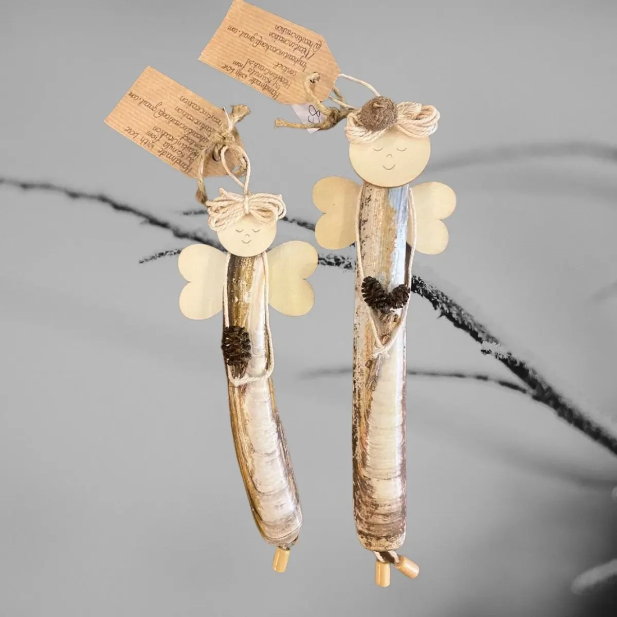 Beautiful Handmade Shell Ornament Beautiful Handmade Shell Ornament made of Razor seashell with wooden wings and heart.