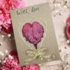 Beautiful Handmade Valentine's Card: A red leaf heart with twine border, "With Love" text, surrounded by pink flowers and baby's breath.