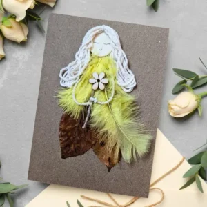 Handmade and fancy birthday card for her made of leaf and yellow feathers.