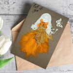 Handmade romantic card for her featuring an orange feathers and wood alongside a delicate butterfly design.