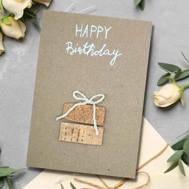Charming Homemade Birthday Card – Celebrate with a Truly Unique Design Charming Homemade Birthday Card – Celebrate with a Truly Unique Design. Made of cork and white cotton bow on brown paper.