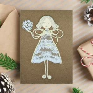 Christmas Card to Dad from Daughter - I Love You, Daddy Handmade Christmas Card to Dad from Daughter. The girl made of lace in the image is holding a snowflake.
