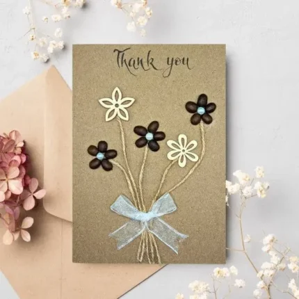 Floral handmade thank you card with flowers made of wood and coffee beans with bow.