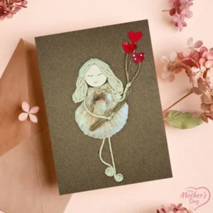 Cute Homemade Card for Your Mother with Flower A Homemade Card for Your Mother featuring a girl holding a heart-shaped balloon, crafted with seashells on brown paper.