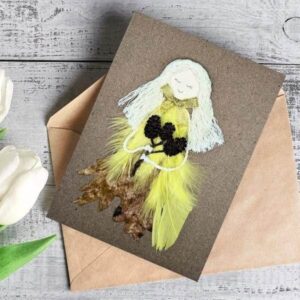 Enchanted Handmade with Love Card for Her Enchanted Handmade with Love Card for Her made of dry leaf, yellow bright feathers, cotton string and small cones.