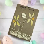 Festive handmade colourful happy Easter card with Yellow Spring Daffodil Flowers and Egg. Made in the UK.