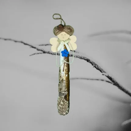 The image shows a Handcrafted Razor Shell Blessing ornament made of Razor shell. Has long, flowing hair and delicate wings.