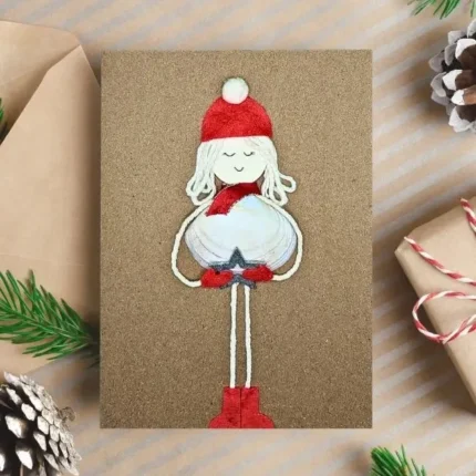 Handmade and Personalised Merry Christmas card with showgirl made of white seashell.