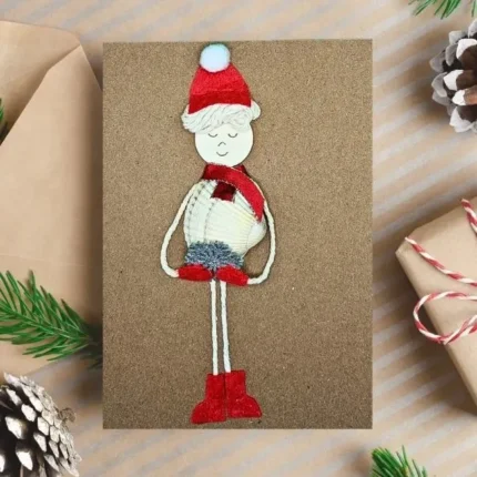 Handmade Personalised Christmas card with snow boy made of white seashell.