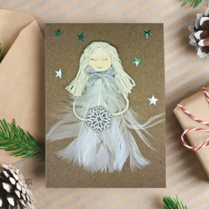 Handmade and beautiful Angel Christmas Card with a unique white Angel made of feathers and snowflake.