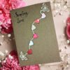 Handmade and Beautiful Valentine's Day Card for Your Wife with colourful small paper hearts and butterflies.