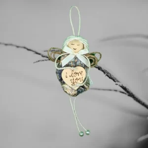 Handmade and Unique Shell Christmas Ornament for Home image 1 The image depicts a unique Shell Christmas ornament made from an oyster shell, featuring a heart that has the words 'I love you' written on it.