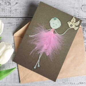 Handmade Ballerina Birthday Card for Wife made of pink feathers and wooden bird on brown paper.