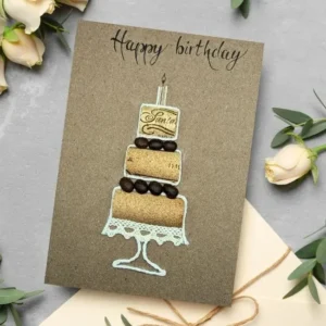 Handmade Beautiful and Unique Birthday Card featuring a beautifully designed cake with the text Cake Your Day! for a unique celebration. Made of paper and coffee beans.