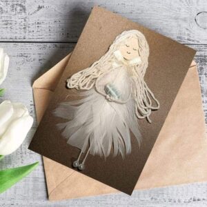 Handmade card for new mother with white feathers on a brown reusable envelope.
