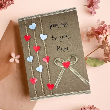 Handmade Card for Parents - I love you, Mom, I love you, Dad. Made of paper hearts on brown paper.