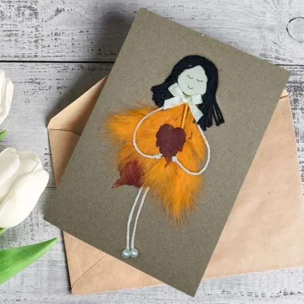 Handmade Card for Women. A Beautiful greeting card made of orange feathers and dry leaf's. Made in the UK.