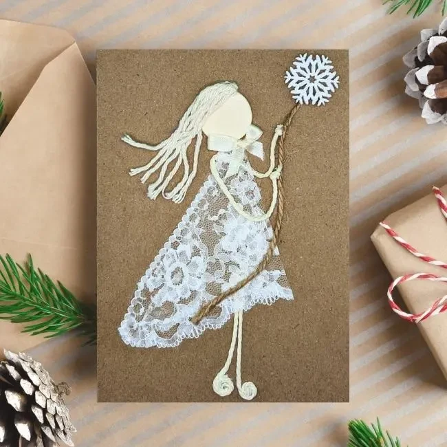 Handmade Christmas Card for Grandparents from Granddaughter image 1 Handmade Christmas Card for Grandparents with a smiling girl made from lace fabric holding a star.