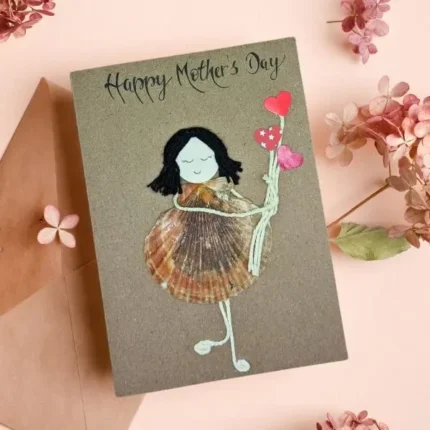 Handmade Happy Mother's Day Card for A Sister made of sea shell on brown paper.