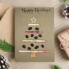 Handmade personalised Christmas Tree card made of coffee beans, wooden star and cork.
