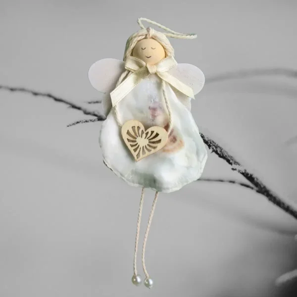 Handmade Seashell Christmas Ornament - A Coastal Christmas Treasure Handmade Seashell Christmas Ornament made of white seashell, wooden heart and wings.