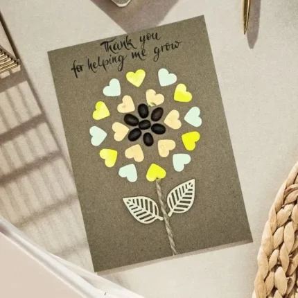 Handmade Teachers Day Card - Thank You Me Grow. Made of coffee beans and wood with handmade calligraphy.