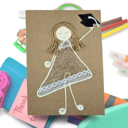 Handmade thank you graduation card featuring a girl in a graduation gown holding a cap, celebrating her achievement.