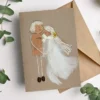 Handmade Wedding Card That Says I Love You. Made of cork and white feathers. Perfect for Anniversary or Valentine's Day as well.