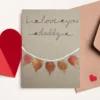 Heartfelt greeting card for Dad with the text ‘I Love You, Daddy’. It is made of leaves on reusable brown paper.