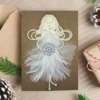 Heavenly Beautiful Handmade Angel Christmas Card Beautiful Handmade Angel Christmas Card for wife featuring a girl made of a white feather, holding a wooden snowflake.