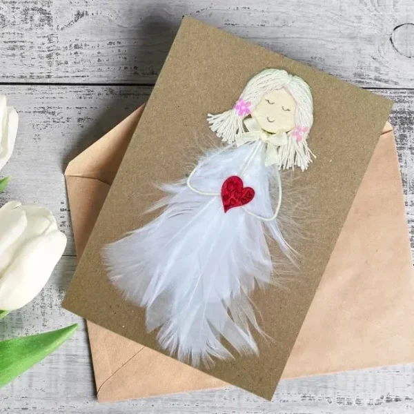 Luxury Handmade Card for Her, crafted from white feathers and adorned with a small red heart.