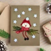 Handmade Christmas Card with Santa for Kids with a bird pretending to be Santa Claus.