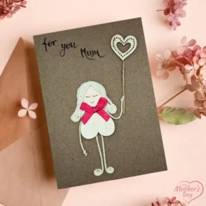 Perfect Cute Homemade Card for Mother from Her Daughter Perfect Cute Homemade Card for Mother from Her Daughter made of wood, red bow and cotton string on brown paper.