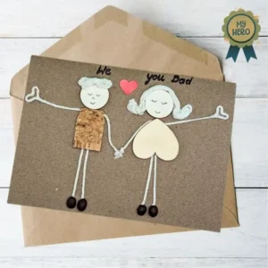 Perfect Handmade Card for a Happy Father's Day Perfect handmade card for a happy Father's Day with stick figures holding hands, crafted with cork, yarn, and coffee beans. Rustic and heartfelt design.