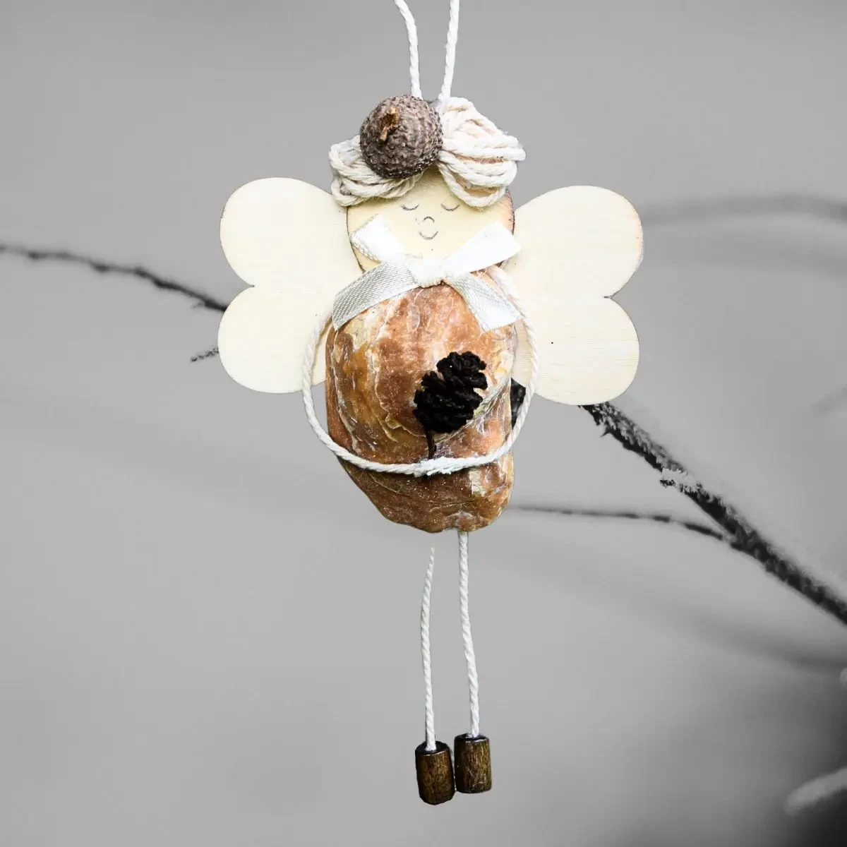 Perfect Handmade Shell Ornament - A Gift for The Seashell Lovers Perfect Handmade Shell Ornament - A Gift for The Seashell Lovers. Made of brownish seashell, wooden wings and corn.