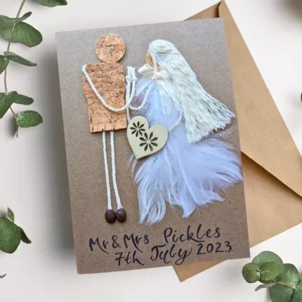 Handmade personalised anniversary card for husband and wife made of cork and feathers.