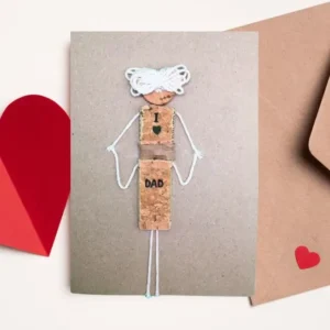 Personalised Handmade Father's Day Card – Crafted with Love Personalised handmade Father's Day card showing a dad and son made of cork giving his child a piggyback ride.
