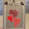Personalised Handmade Valentine's Card on table with three leaves in the shape of a heart.