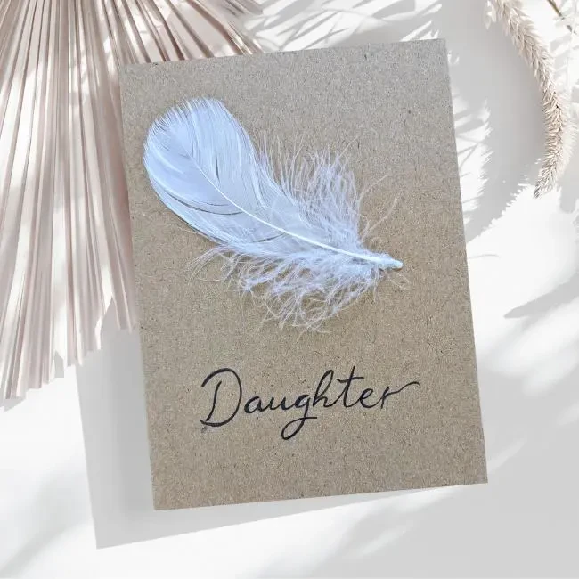 Simple Handmade Sympathy Card - Angel Feather Simple handmade sympathy card made of white feather on brown paper.
