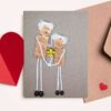 A special homemade card for your Father design depicts a heart-warming scene of a son giving a yellow flower to his dad made of cork.