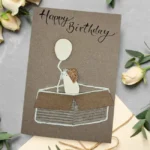 Squeaky Surprise - Unique Handmade Birthday Card showing mouse with the balloon in the box. Made on the eco-friendly brown paper.