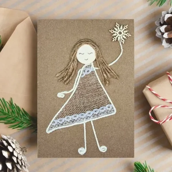 Unique and Beautiful Christmas Card for Mum from Daughter Unique and Beautiful Christmas Card for Mum from Daughter with a beautiful girl holding snowflake made of lace and cotton string.