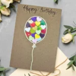 Unique Birthday Card Idea with Handmade Colourful Balloon and text 'Happy Birthday'. Made in Bollington, UK.