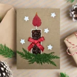 Handmade Candle Christmas Card with Candle and Ribbon made of coffee beans, leaf, green twig and paper stars.