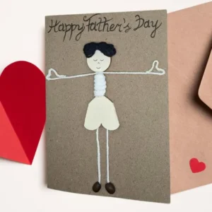 Unique Handmade Happy Father's Day Card Idea Handmade Happy Father's Day Card idea. The card features a simple yet charming figure of a wooden boy with black hair.