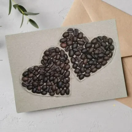Unique handmade Valentines Day card to truly impress your loved one, featuring two hearts made of coffee beans.